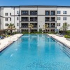 resort style pool with seating in a courtyard