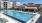 a swimming pool in front of a building