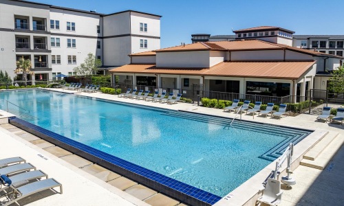 a swimming pool in front of a building