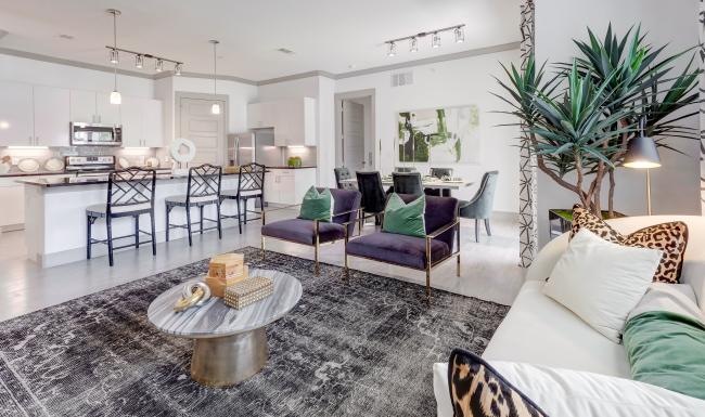 a living room with a dining room and kitchen