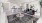 a large living room with a dining table and chairs