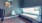 a tanning bed with a chair and a table in a room