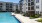 a pool in a courtyard between buildings