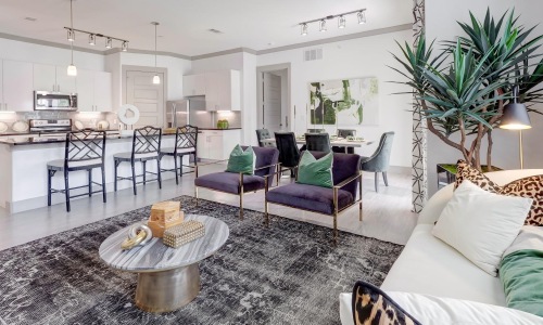 a living room with a dining room and kitchen
