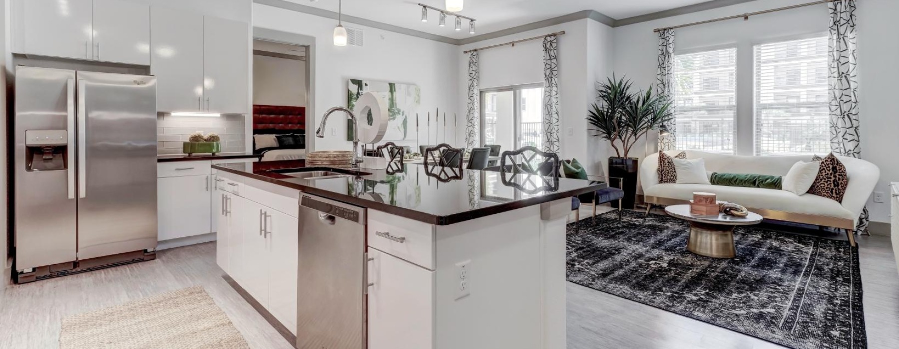 a kitchen with white cabinets